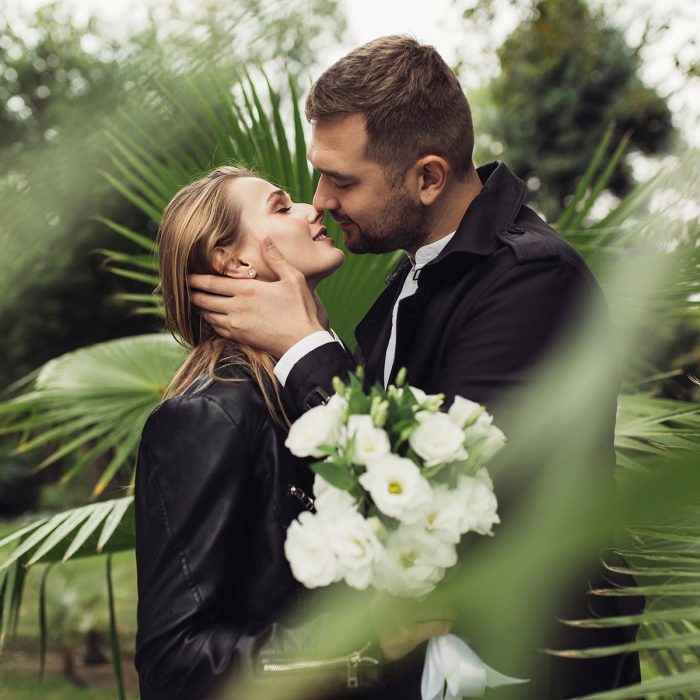 young-attractive-man-in-trench-coat-happily-kissin-WSP75ZF-min.jpg