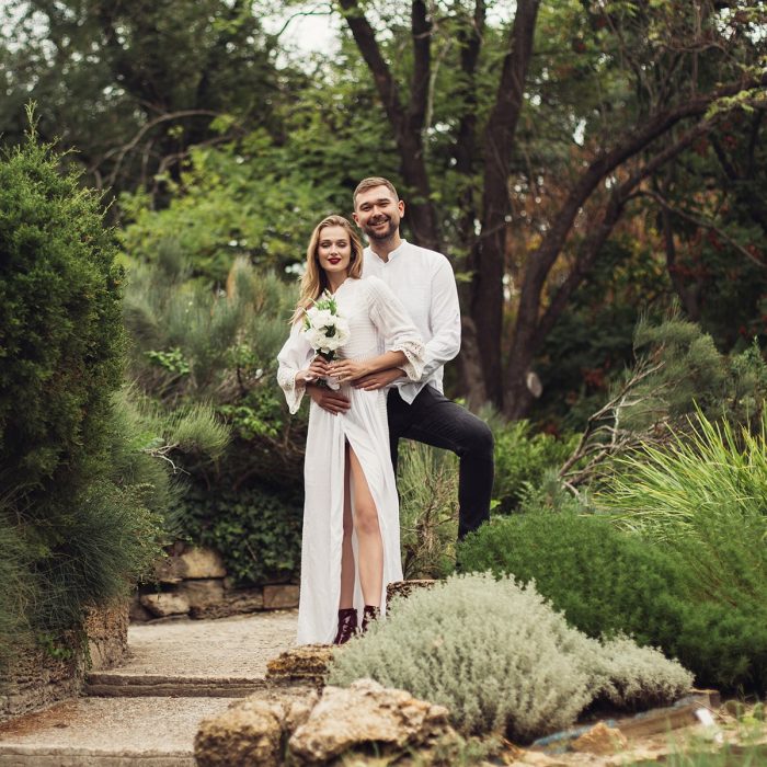 young-joyful-groom-in-shirt-embracing-pretty-smili-5AENRKQ-min.jpg